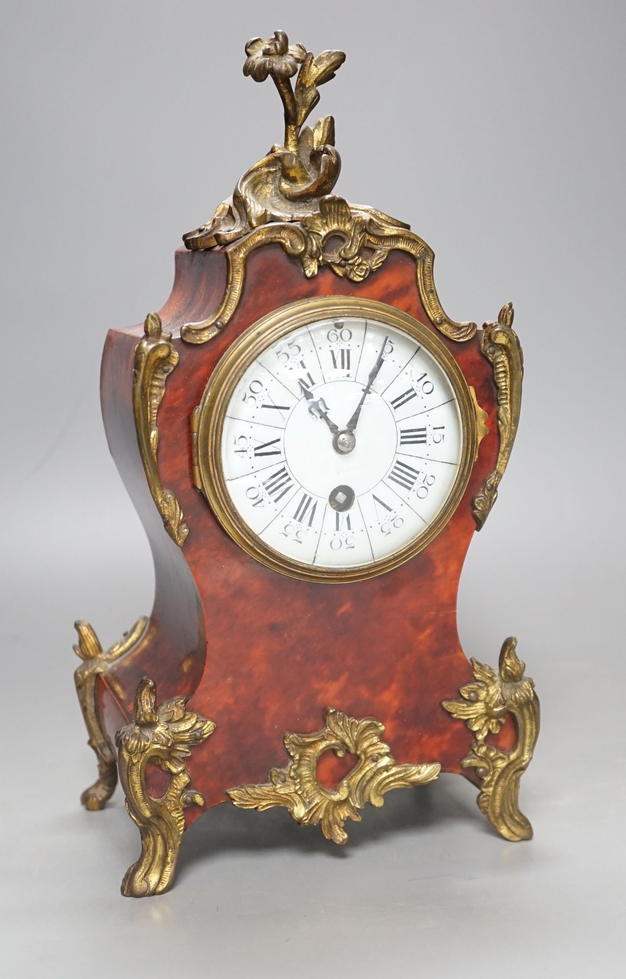 19th century French tortoiseshell veneered mantel clock, 31cms high.